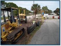Two yellow digging machines