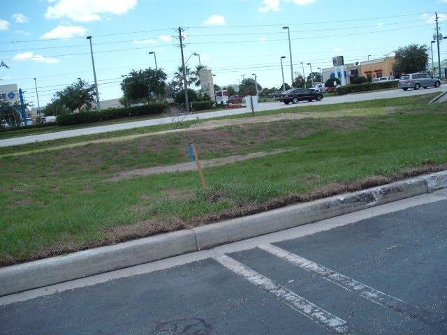 Parking area by grass